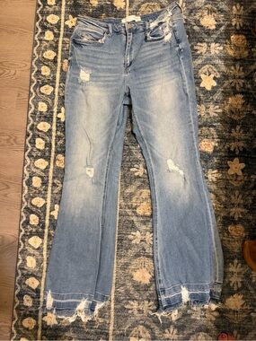 Buckle Women’s Distressed Light Blue Flare Jeans